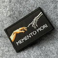 Memento Mori embroidered morale patch, black with skeletal hand, 9.5x5.5 cm