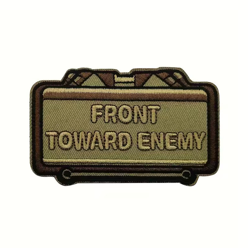 Front Toward Enemy Claymore morale patch, tan PVC, hook-backed